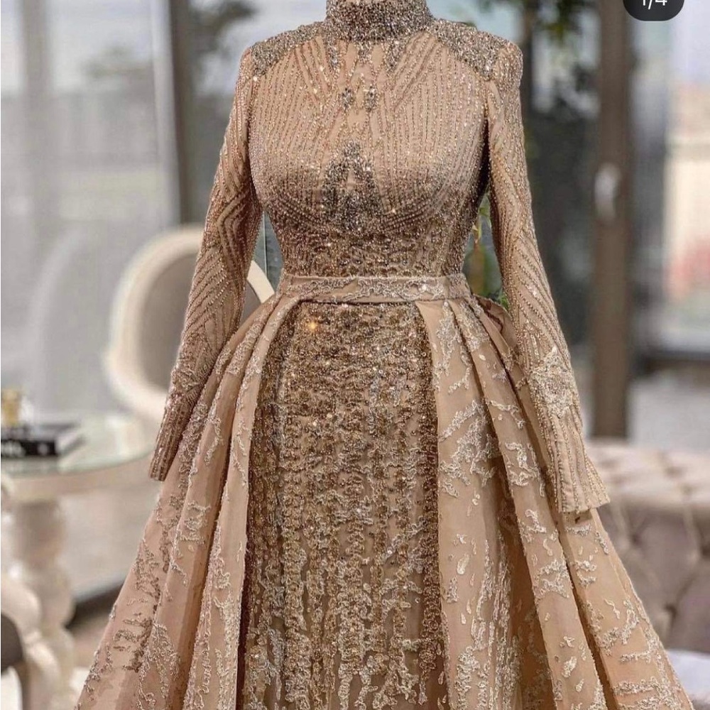 Glamorous hand beaded ball gown.